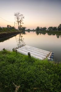 Scenic view of lake against sky during sunset