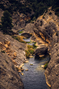 High angle view of rocks by river