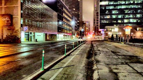 Illuminated buildings in city at night