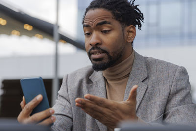 Businessman talking on video call through smart phone