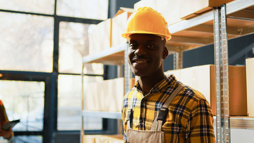 Portrait of young man standing in city