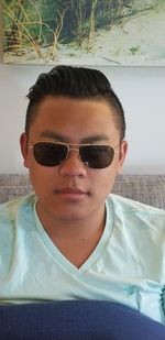 Portrait of young man wearing sunglasses