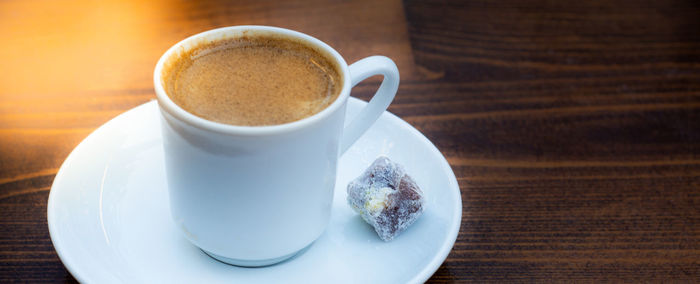 Close-up of coffee cup on table