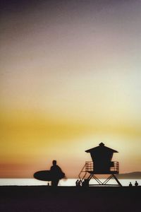 Silhouette of people at sunset