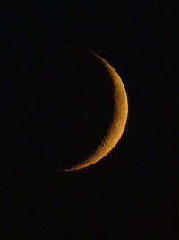 Low angle view of moon against sky at night