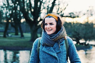 Portrait of young woman standing outdoors