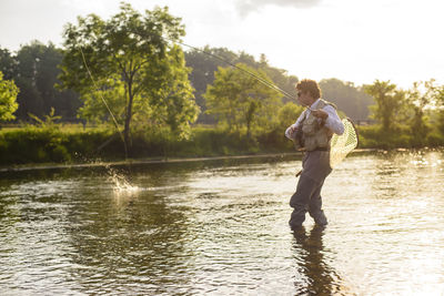 Flyfishing at sunset on a southeastern river.