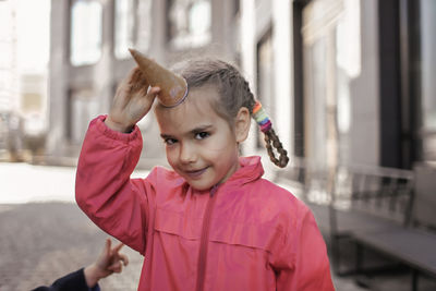 Portrait of girl standing outdoors