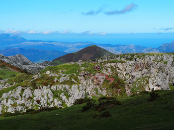 Scenic view of landscape and mountains against sky