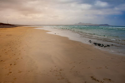 Scenic view of beach against sky