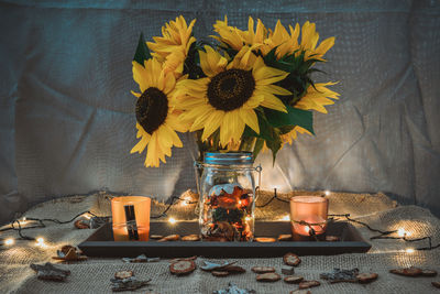 Close-up of sunflowers on table at home