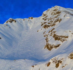 Traces of skiers on dangerous slope