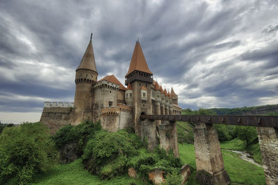 Historic building against cloudy sky