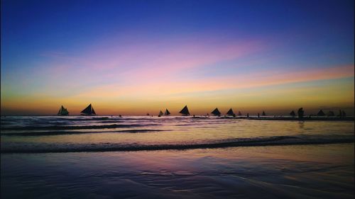 Scenic view of sea at sunset