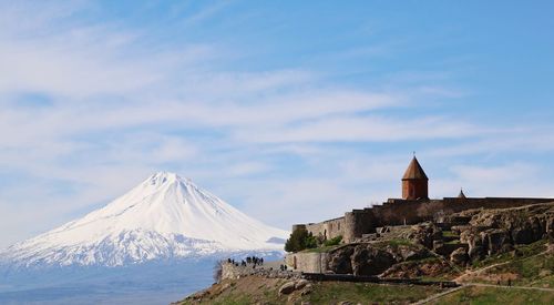 View of monastery against cloudy sky