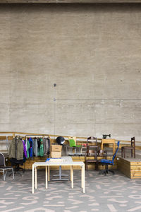 Tables with recycled goods and furniture in recycling center