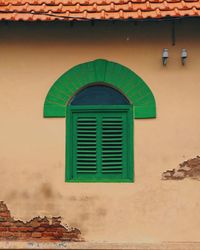 Close-up of window on wall of building