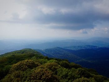 High angle view of mountain range against cloudy sky