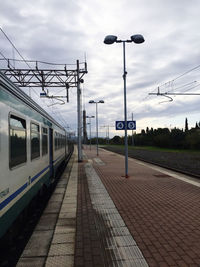 Train on railroad station platform against sky