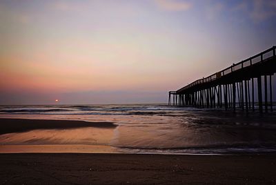 Scenic view of calm sea at sunset