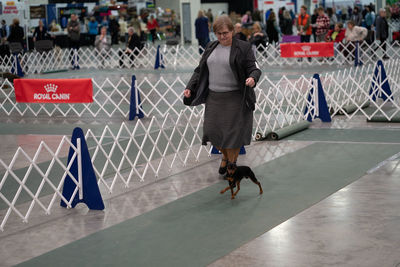 Full length of man running on fence