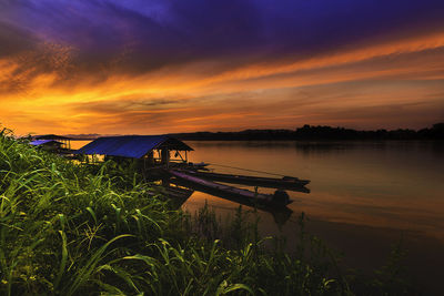 Scenic view of lake against sky during sunset