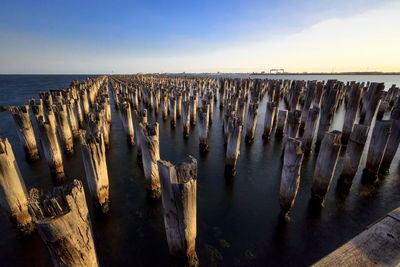 View of poles in calm water