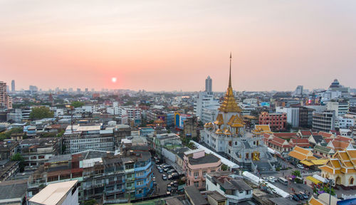 High angle view of city at sunset
