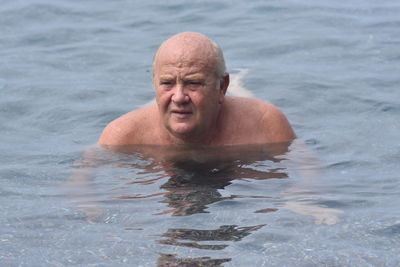 Portrait of man swimming in sea