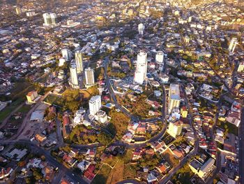 High angle view of city lit up at night