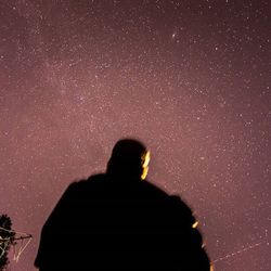 Silhouette of woman at night