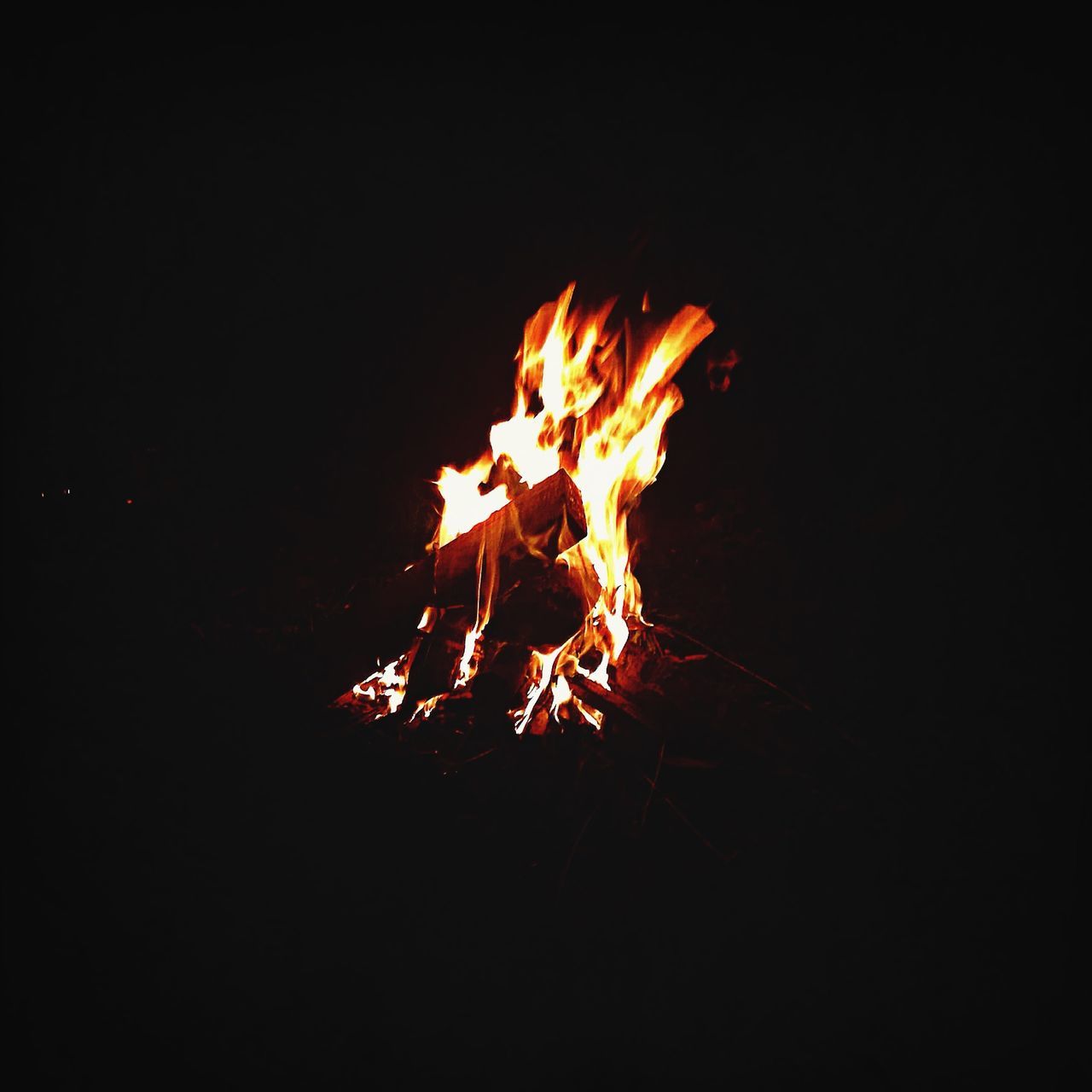 flame, burning, fire - natural phenomenon, night, heat - temperature, glowing, bonfire, copy space, studio shot, fire, dark, close-up, black background, orange color, firewood, motion, campfire, no people, long exposure, outdoors