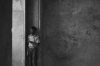 Full length of man standing in corridor