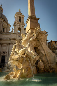 Statue of historic building against sky