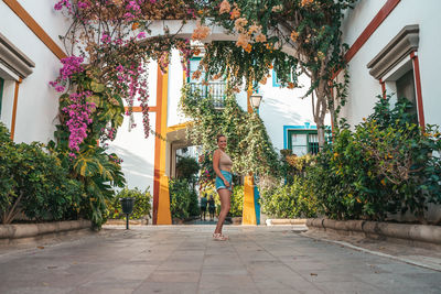 Rear view of woman walking on street