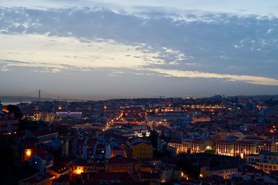 High angle view of illuminated cityscape against sky