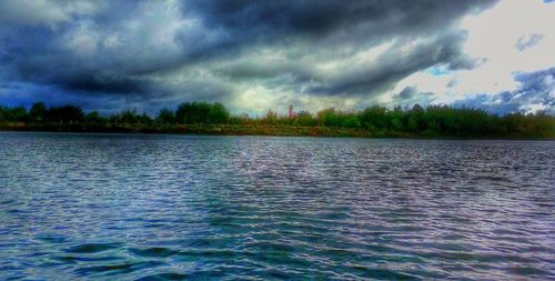 Scenic view of sea against cloudy sky