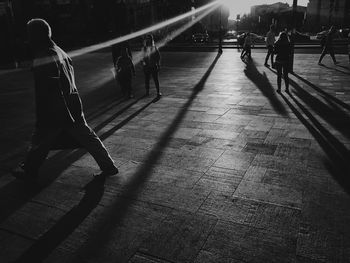 People standing on sidewalk