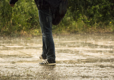 Low section of man standing outdoors