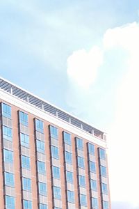 Low angle view of office building against sky