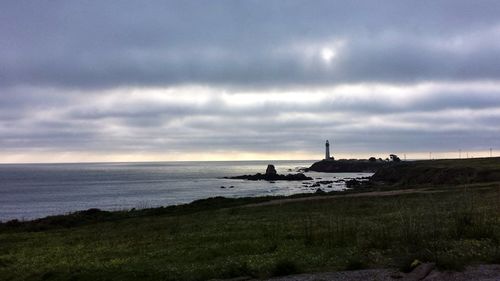 Scenic view of sea against cloudy sky