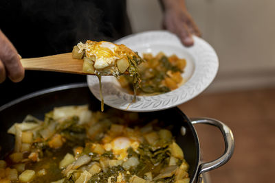 Close-up of hand holding food