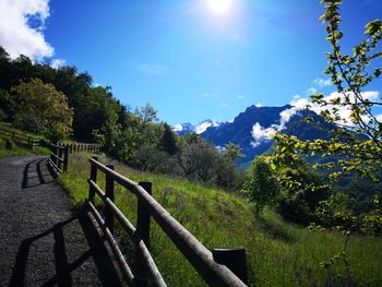 Scenic view of mountains against sky on sunny day