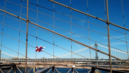 Suspension bridge against blue sky