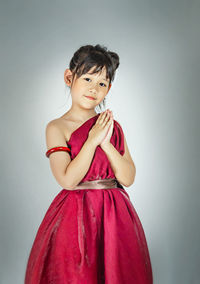 Portrait of a beautiful young woman over white background
