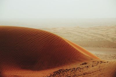 Scenic view of desert against clear sky