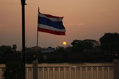 Flag against sky during sunset