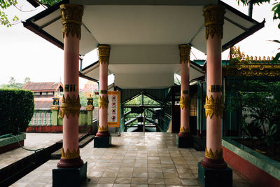 Corridor of building against sky