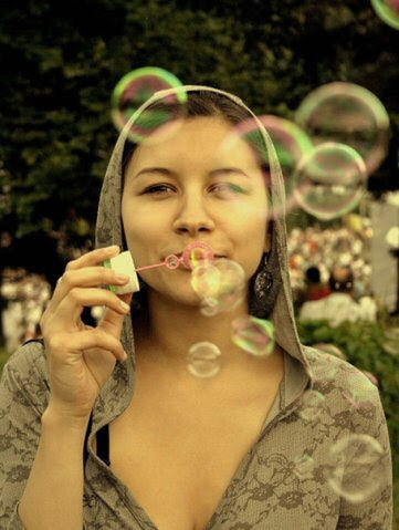 one person, portrait, holding, young adult, headshot, adult, blowing, front view, bubble wand, food and drink, women, beautiful woman, brown hair, beauty, bubble, enjoyment, looking at camera, day, hair, hairstyle