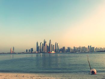 Sea with city in background